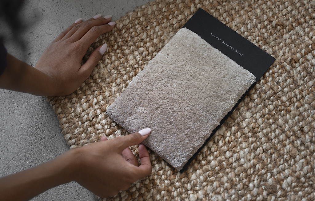 person choosing carpet, holding carpet sample