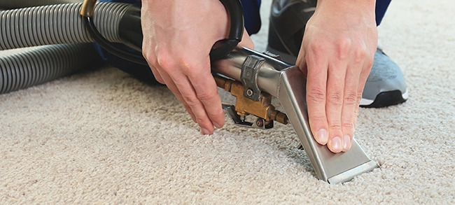 man cleaning carpet stains