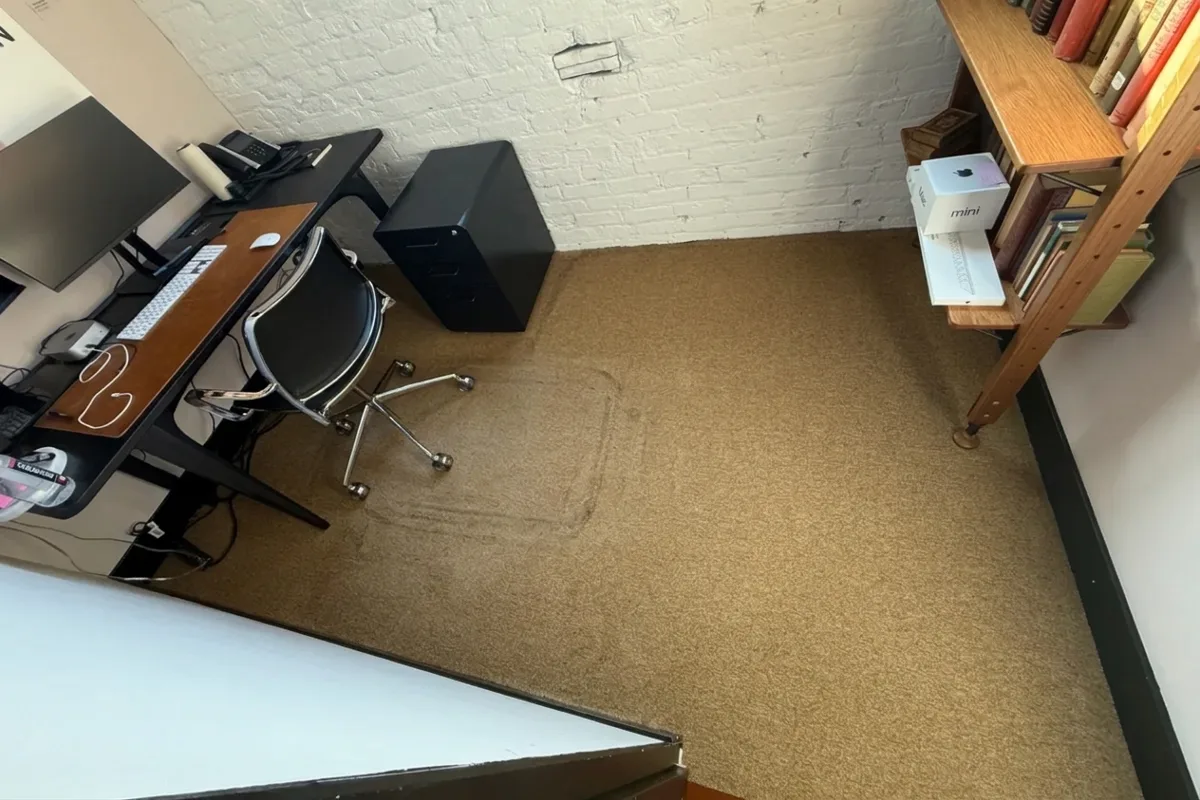Soiled commercial office carpet before truck-mounted hot water extraction in a Chicago suite