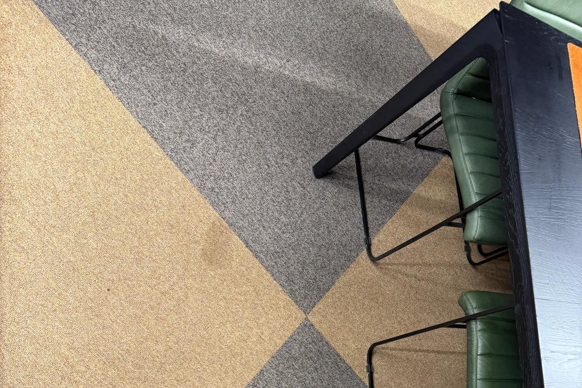 Second wool area rug after on-site cleaning in a Chicago office