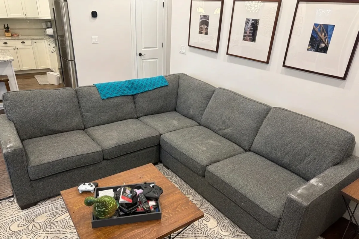Large sectional sofa in a Lincoln Square living room before upholstery cleaning